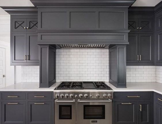 Grey and white classic timeless kitchen by The Fox Group. Come be inspired by more Timeless Interior Design Ideas, Paint Colors & Furniture. #thefoxgroup #benjaminmoorecheatingheart #kitchendesign #greycabinets #subwaytile #greyandwhitekitchen